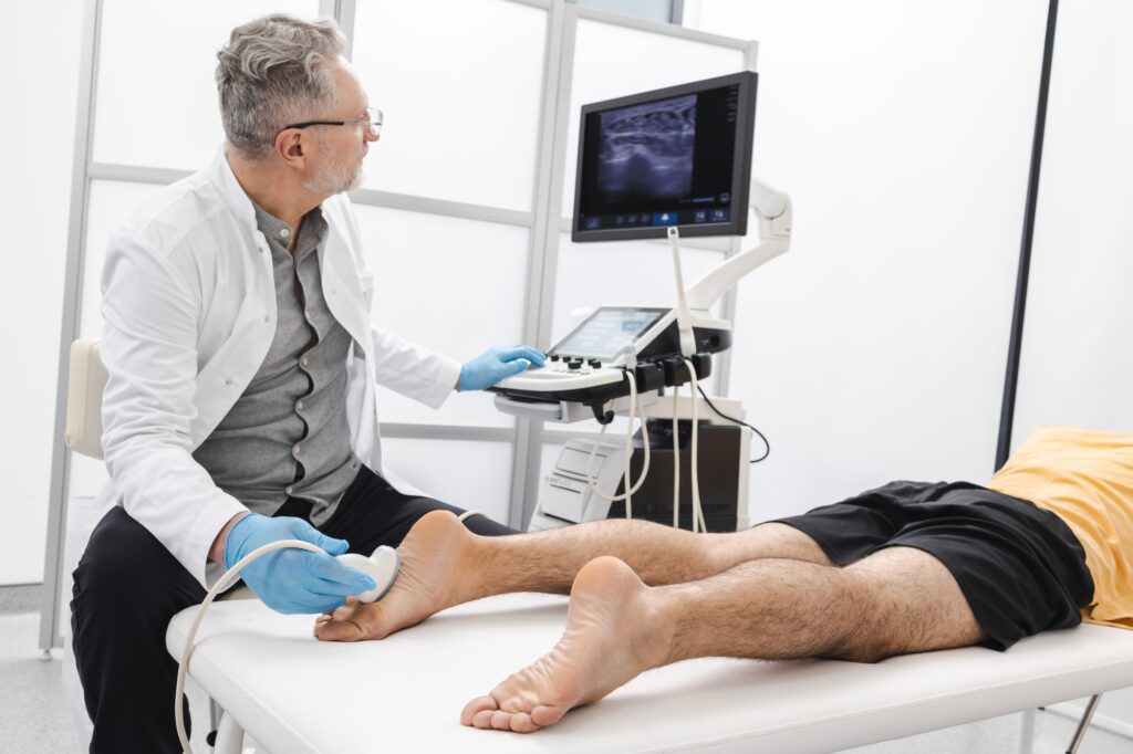 Doctor performing an ultrasound on a patient