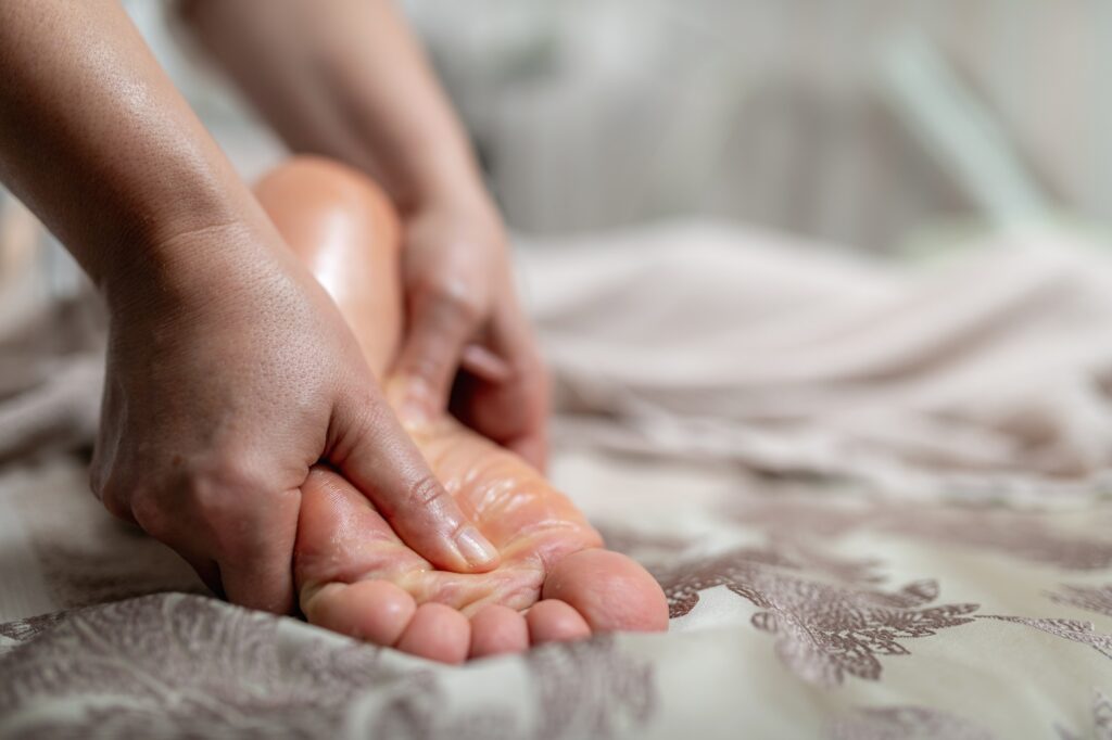Hands massaging a foot